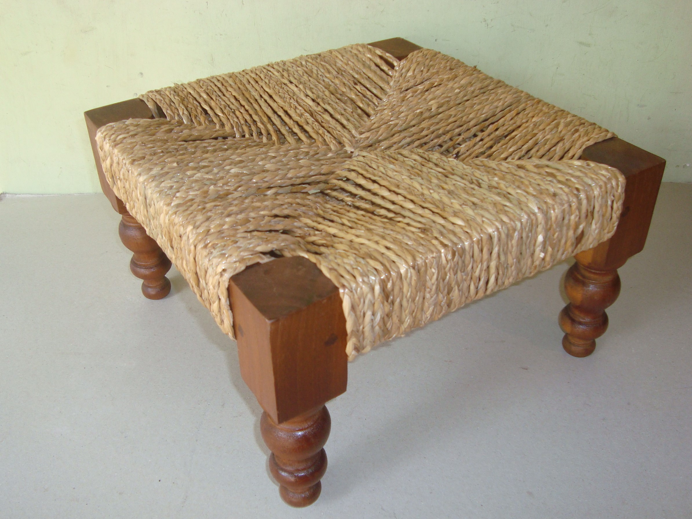 Foot stool made from wood and wicker
